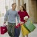 Couple on City Sidewalk with Shopping Bags