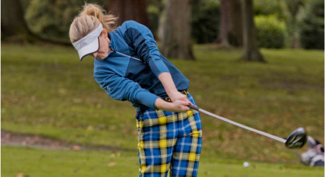 Female golfer in My Name'5 Doddie tartan